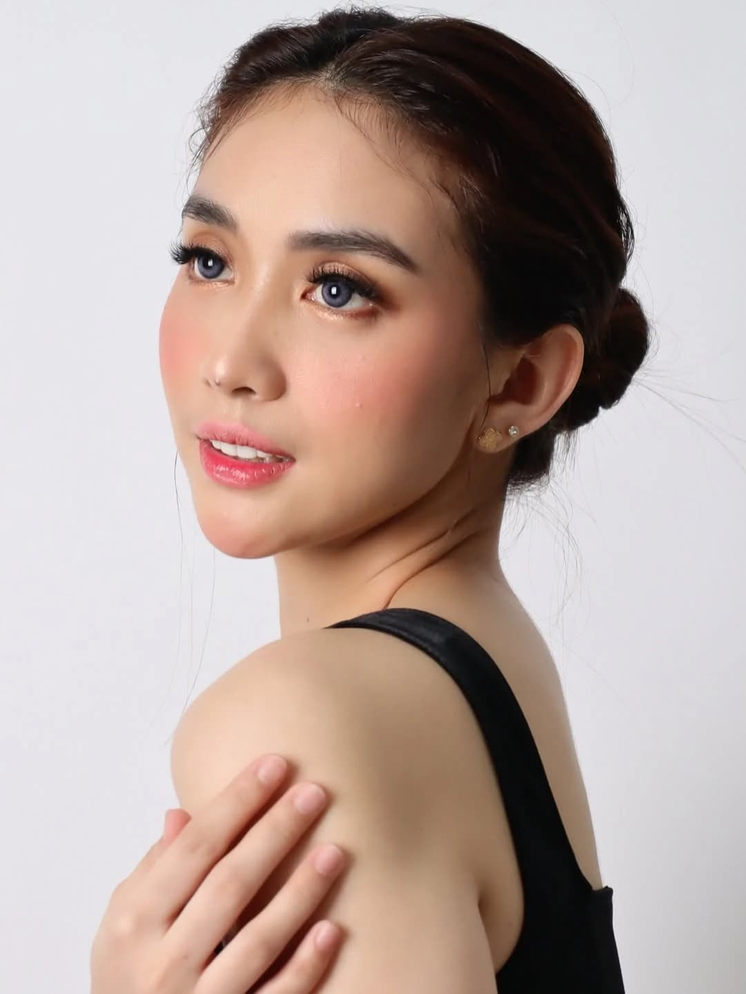 Crissa Makeup Artistry — black sleeveless glam profile portrait