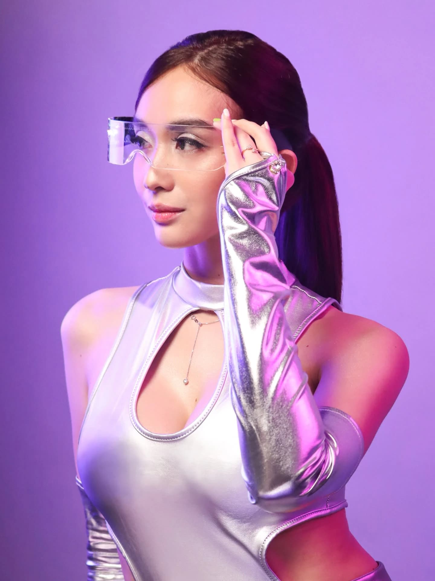 Crissa Makeup Artistry — futuristic silver editorial face touch pose