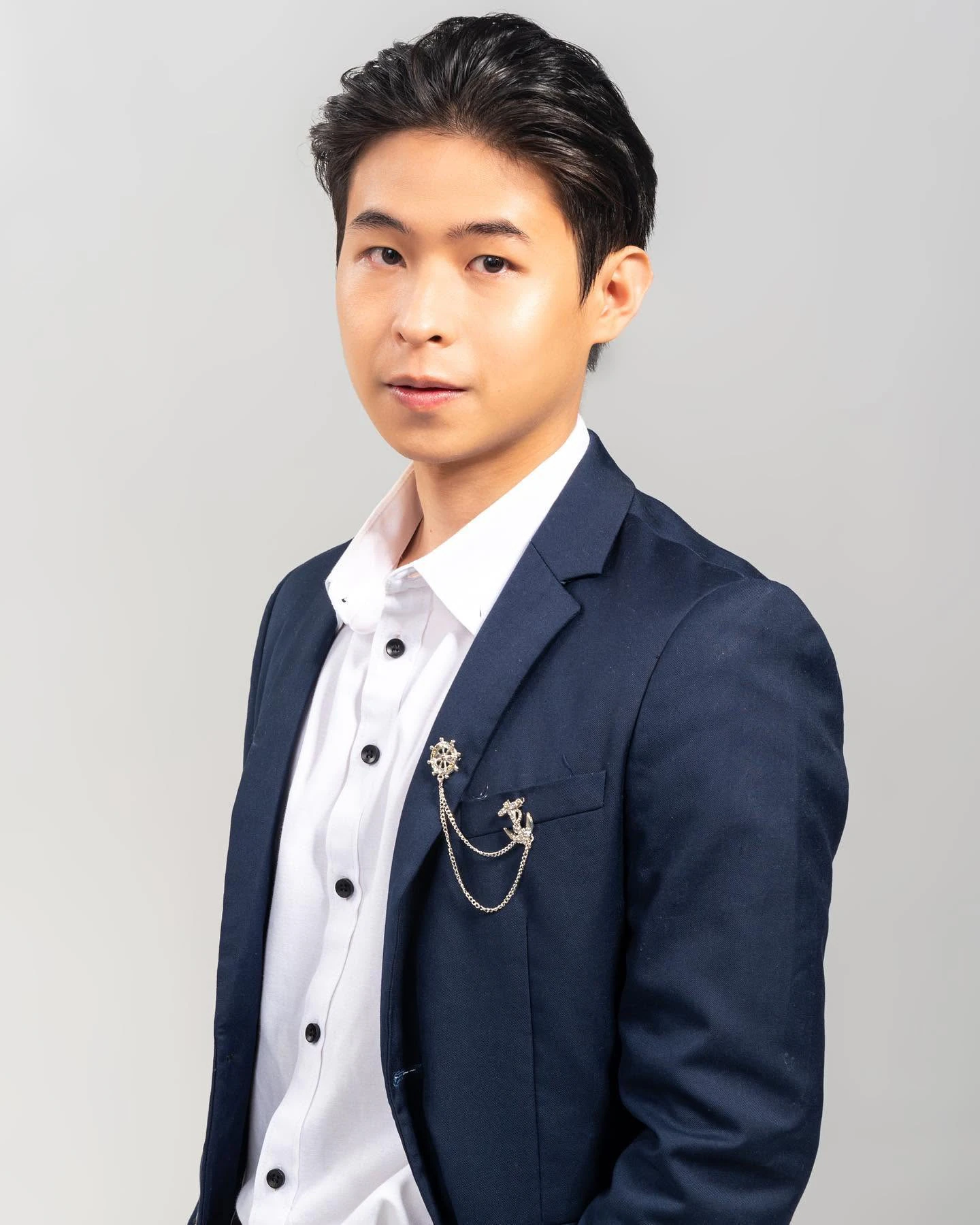Male portrait with polished formal grooming and makeup