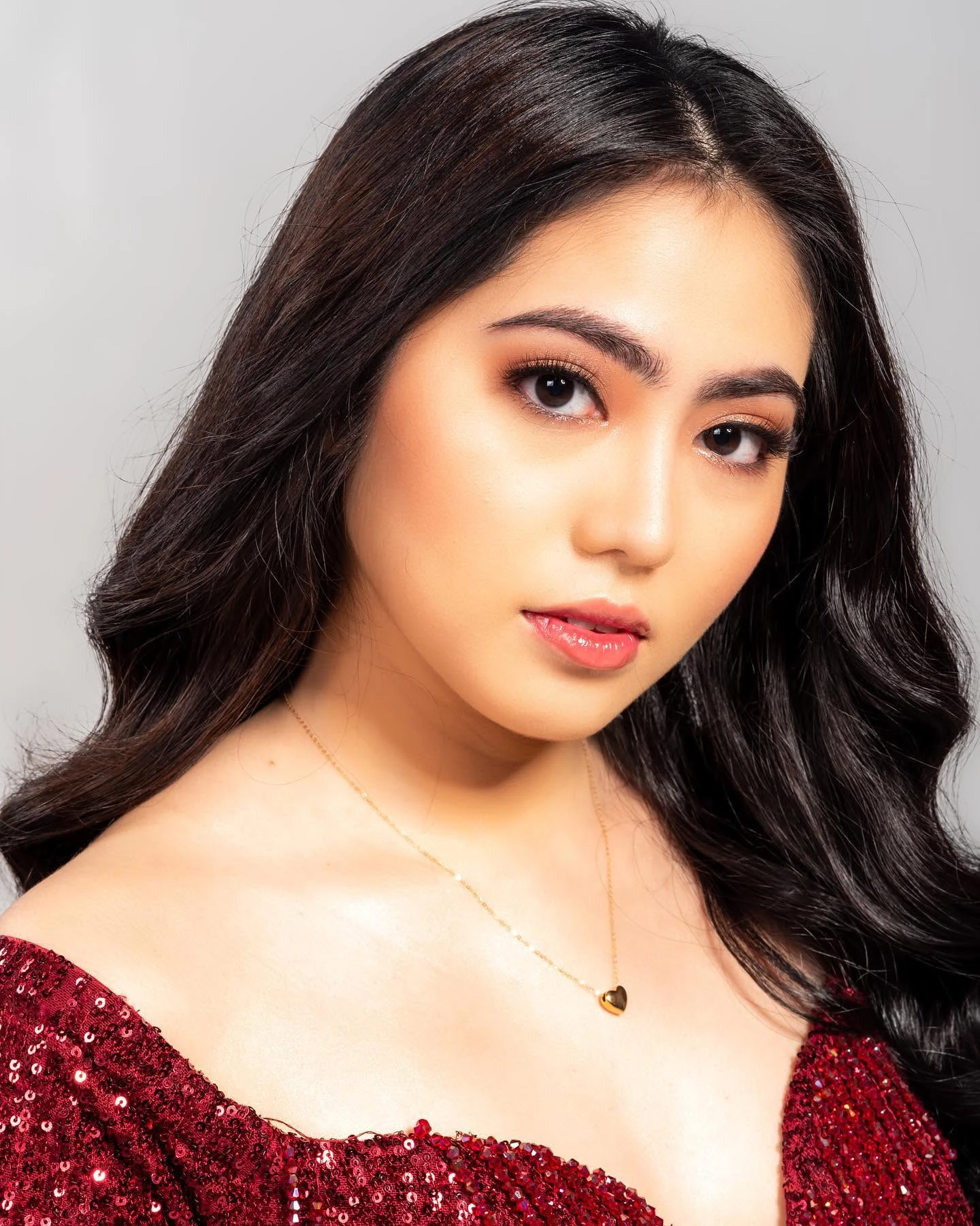 Beauty portrait with camera-ready glam makeup and softly waved hair