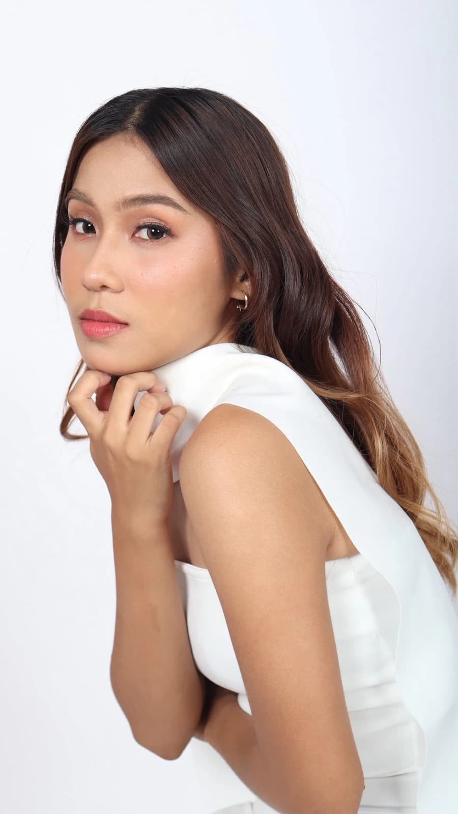 Crissa Makeup Artistry client with soft studio makeup and luminous skin